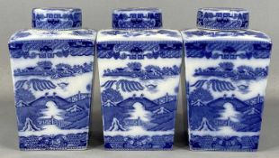 RINGTONS LTD. TEA MERCHANTS: THREE BLUE & WHITE TRANSFER DECORATED TEA CADDIES of square tapered