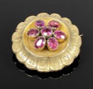 VICTORIAN, POSSIBLY 9CT GOLD, CIRCULAR FLORAL BROOCH set with garnets, 35mm diam Provenance: private