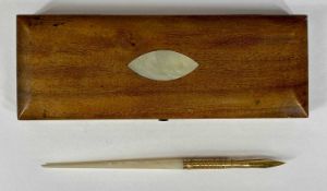 ANTIQUE DIPPING PEN with mother of pearl handle and yellow metal mount, yellow metal nib marked '