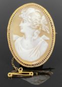 ANTIQUE OVAL CAMEO PORTRAIT BROOCH in pierced 9ct gold mount having safety chain, 45 x 35mms