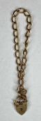 9CT ROSE GOLD CURB LINK BRACELET, heart shaped locket, safety chain, 9gms Provenance: deceased