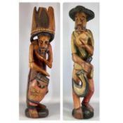 TWO CARIBBEAN PAINTED CARVED WOOD FIGURES of farmer, 89cms (h) and drummer, 92cms (h) Provenance: