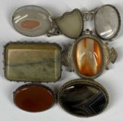 SEVEN ASSORTED SILVER MOUNTED HARDSTONE BROOCHES Provenance: private collection Conwy