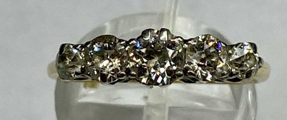 YELLOW METAL RING set with band of five diamonds, total approx. 1.0 carat, size P Provenance: