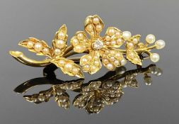 VICTORIAN YELLOW METAL FLOWER & LEAF FORM BROOCH set with seed pearls and small central diamond,