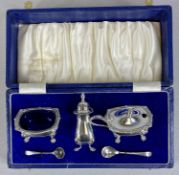 CASED SILVER CONDIMENT SET of oval form, on claw feet, pepperette, hinged pepper pot and open salt