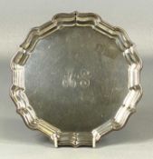 AMERICAN WHITE METAL CARD TRAY, circular with moulded rim, monogrammed to centre, marked Reed &