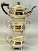 GEORGE V SILVER THREE PIECE TEA SERVICE of oval form, gadrooned rim, on paw feet, teapot having