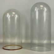 TWO VICTORIAN GLASS DOMES, 43cms (h), 18cms (diam.) and 37cms (h), 18cms (diam.) Provenance: private