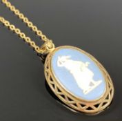 WEDGWOOD BLUE BASALT PENDANT classical figure in pierced 9ct gold mount, 25 x 13mms with chain