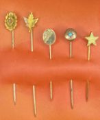 FIVE/YELLOW METAL STICKPINS including 15ct oval having inset diamond, 9ct maple leaf, 9ct oval form,