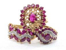 THREE 9CT RUBY RINGS, comprising two with diamond accents, a third with filigree design, tot gross