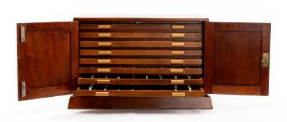 20TH CENTURY MAHOGANY COIN COLLECTORS CABINET, panelled doors enclosing eight shallow velvet-lined