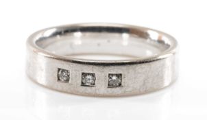 18CT WHITE GOLD & DIAMOND WEDDING BAND, set with three small brilliant cut diamonds, in Paul Gentile