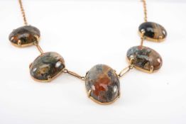 9CT GOLD BELIEVED MOSS AGATE NECKLACE, of graduated cabochon design, 10.2gms Provenance: private