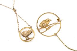 ANTIQUE 9CT GOLD OPENWORK CIRCULAR BROOCH, depicting a chick with ruby eye and a single pearl,