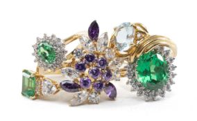 FIVE DRESS RINGS, including 9ct single stone presumed pale aquamarine, three 9ct simulated emerald