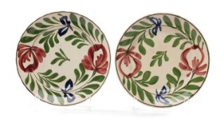 TWO LLANELLY 'PERSIAN ROSE' POTTERY PLATES, with shallow scalloped rims, boldly painted with