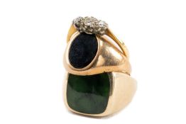 TWO 9CT GOLD RINGS comprising one set with green hardstone and another set with onyx, 12.1gms