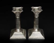 PAIR OF GEORGE V SILVER CORINTHIAN COLUMN CANDLESTICKS, Elkington & Co, Sheffield 1912, square
