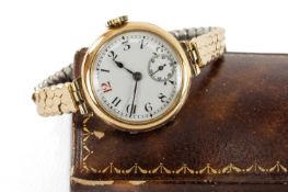 15CT GOLD LONGINES LADIES' WRISTWATCH, white enamel Arabic dial with subsidiary seconds, red '12',