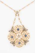 ANTIQUE 15CT GOLD OPENWORK PENDANT, of flowerhead design set with four sapphires, ten rose cut
