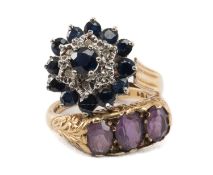TWO 9CT GOLD RINGS comprising a sapphire and diamond chip cluster and a three stone amethyst, 6.9gms