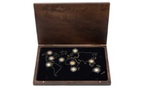 THE BIG NINE GOLD COIN COLLECTION containing 7 x 0.5g 24ct miniature gold coins, Canadian Maple,