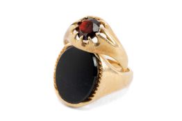 TWO 9CT GOLD RINGS comprising garnet and onyx set, 9.7gms gross (2) Provenance: private collection