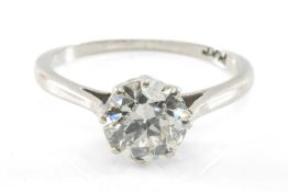 SOLITAIRE 1CT DIAMOND RING, the modern brilliant-cut stone set in plain platinum shank with bridge