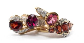 FOUR 9CT GARNET AND TOPAZ RINGS, comprising rhodolite garnet with diamond shoulders, 5-stone