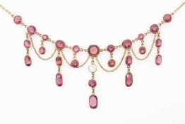 YELLOW METAL SET MULTI-GEM BELLE EPOQUE FESTOON STYLE FRINGE NECKLACE, believed pink tourmaline
