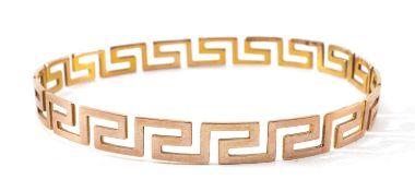YELLOW METAL GREEK KEY CLOSED BANGLE, Rd No. 683943, stamped '9', 16.9gms Provenance: private