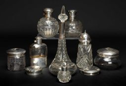 GROUP OF SILVER comprising three glass and silver topped dressing table jars, four silver and