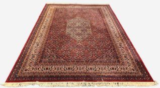 BIDJAR STYLE ORIENTAL RUG, central hexagonal pale medallion on a Herari madder field, angled