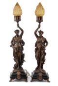 PAIR PATINATED SPELTER FIGURAL TABLE LAMPS, classical figures holding up torches, on Belgian slate