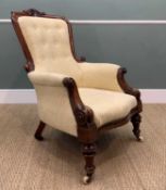 MID-VICTORIAN CARVED WALNUT LIBRARY ARMCHAIR, leaf scrolled carved cresting rail, scrolled arms,