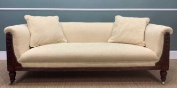 LATE VICTORIAN MAHOGANY SETTEE, leaf carved front scrolled arms and back, ceramic castors,