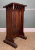 CARVED STAINED PINE LECTERN, triple panelled floral front raised on peg joined stile feet, 106cms (