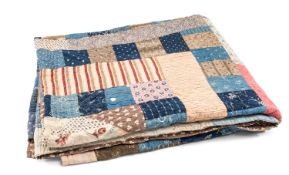 VINTAGE WELSH COTTON PATCHWORK QUILT, decorated in coloured geometric and floral-patterned squares