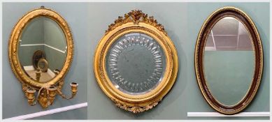 THREE DECORATIVE WALL MIRRORS, including Victorian oval gilt gesso girandole, 69cm h, Edwardian