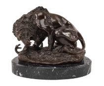 BRONZE AFTER ANTOINE LOUIS BARYE Lion and Snake, on variegated black marble oval plinth, 25cms (h)