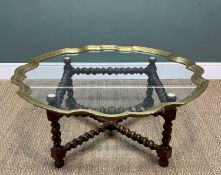 LARGE BRASS EDGED GLASS COFFEE TABLE, freestanding piecrust shaped glass top resting on square