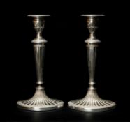 PAIR SILVER PLATED CANDLESTICKS, oval fluted form with ornamented borders, base stamped '