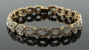 DIAMOND ENCRUSTED 9CT GOLD BRACELET, double helix design, 19cms long, 14.5gms in box Provenance: