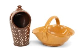 TWO VERNACULAR POTTERY ITEMS, comprising Ewenny Clay Pits fruit basket, the over handle incised '