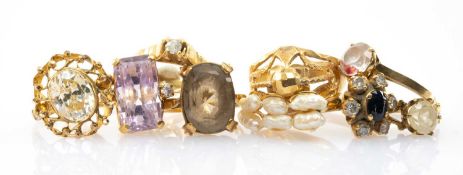 GROUP OF NINE YELLOW METAL MULTI-GEM SET RINGS, of various size and design, 42.6gms gross (9)