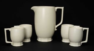 KEITH MURRAY (1892-1981) FOR WEDGWOOD: POTTERY LEMONADE SET, comprising jug and four mugs, cream