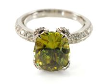 KAT FLORENCE 18K SPHENE & DIAMOND RING, oval SJP cut stone set within diamond bow loop claws above