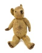 PRE-WAR ENGLISH TEDDY BEAR, golden plush, jointed body, play worn Provenance: given to vendor as